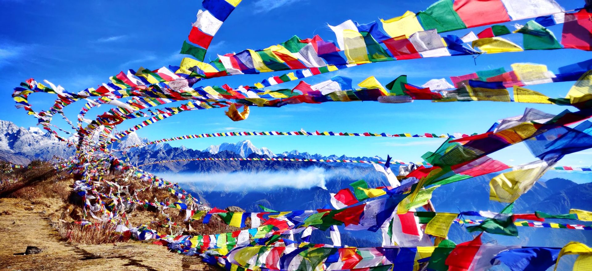 Prayer flags carry blessings on the wind. — 7 Best Upper Mustang Trekking Routes for 2026